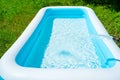 Pool maintenance, filling the pool with clean water. Summer entertainment. Royalty Free Stock Photo