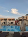 Pool and palm trees on site in egypt Royalty Free Stock Photo