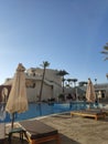 Pool and palm trees on site in egypt Royalty Free Stock Photo