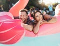 Pool party, portrait and happy couple floating in the water together while on vacation at a resort. Float, summer and Royalty Free Stock Photo