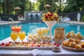 pool party setup with french 75 cocktails in the foreground Royalty Free Stock Photo