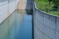 Pool of placid water at bottom of spillway Royalty Free Stock Photo