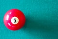 Pool red ball number three with green table empty space for text. Royalty Free Stock Photo