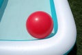 Pool and red big ball Royalty Free Stock Photo
