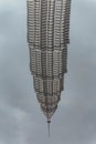 Pool reflected of bended Petronas twin towers in Kuala Lumpur, Malaysia Royalty Free Stock Photo