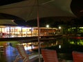 Pool and restaurant in night. Royalty Free Stock Photo