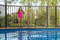 Pool Safety - Girl Outside Fence