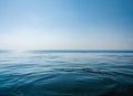 Pool and sea are intersected on the horizon.