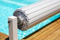 Pool shutter to conserve heat and protect from accidental falls Royalty Free Stock Photo