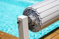 Pool shutter to conserve heat and protect from accidental falls Royalty Free Stock Photo