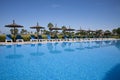 Pool side with hammocks and umbrellas Royalty Free Stock Photo