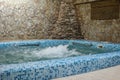 Pool in a small sauna with clear blue water. Royalty Free Stock Photo