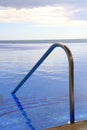 Pool steps and handrail Royalty Free Stock Photo