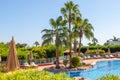 Sharm El Sheikh, Egypt - 11.04.2019: Hyatt Regency Sharm El Sheikh Resort. Pool and sunbeds with umbrellas surrounded by lush