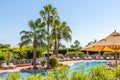 Sharm El Sheikh, Egypt - 11.04.2019: Hyatt Regency Sharm El Sheikh Resort. Pool and sunbeds with umbrellas surrounded by lush
