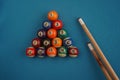 Pool table Billiard snooker ball Game room entertainment. Snooker balls and cue on blue background. Billiard Royalty Free Stock Photo