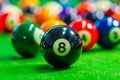 A pool table with eight balls on the green Royalty Free Stock Photo