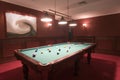 Pool table in elegant red room Royalty Free Stock Photo