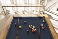 Pool table in minimalistic interior with sunset rays 3D render
