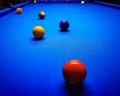 Pool table with ongoing game and multiple balls. blue table. Vivid colors Royalty Free Stock Photo