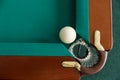 A pool table. Top view. The ball rolls into the pocket. Royalty Free Stock Photo