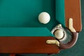 A pool table. Top view. The ball rolls into the pocket. Royalty Free Stock Photo