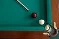 A pool table. Top view. The ball rolls into the pocket. Royalty Free Stock Photo