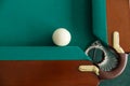 A pool table. Top view. The ball rolls into the pocket. Royalty Free Stock Photo