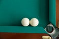 A pool table. Top view. The ball rolls into the pocket. Royalty Free Stock Photo