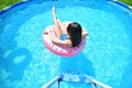 Pool time. Girl has fun in a swimming pool Royalty Free Stock Photo