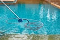 Pool vacuum cleaning dirty in bottom of swimming pool. Royalty Free Stock Photo