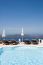 pool view of volcanic island santorini