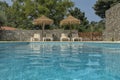 Pool view at the water level with leisure chair.