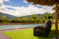 Pool villa resort landscape design and decoration with beach chair and umbrella, wooden chair on patio