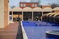 A pool water with blue tile around the crypts of Martin Luther King and Coretta Scott King surrounded by a pool of rippling blue