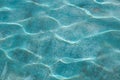 Pool water surface with reflected sun glare for blue background Royalty Free Stock Photo