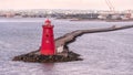 Poolbeg Lighthouse the famous red landmark in Dublin Harbor Ireland seen in the morning Royalty Free Stock Photo