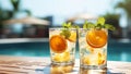 Poolside beverages shine in the radiant sunlight, a perfect way to unwind. Royalty Free Stock Photo