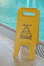 Poolside caution sign Royalty Free Stock Photo