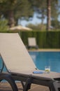 Poolside Lounge Chair With Drink and Tablet Royalty Free Stock Photo