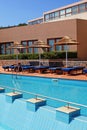 Poolside with pool bed and umbrella in luxury resort Royalty Free Stock Photo