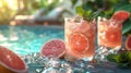 Poolside Table with Grapefruit Mint Juice, Garnished with Fresh Mint Leaves and Grapefruit Slices Royalty Free Stock Photo