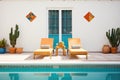 poolside with terracotta sun loungers and spanish tiles