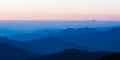 Poonhill view of mountains around Annapurnas. Warm pink and orange sunrise light over Annapurna mountain range with blue sky Royalty Free Stock Photo