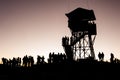 Poonhill view point tower in the morning before sunrise. Silhouettes of trekkers and lookout tower. Poon Hill, Himalayas Royalty Free Stock Photo