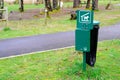 Poop green bag dispenser for dogs in park