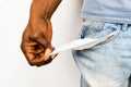 Poor African American Black man in jeans with empty pocket. for broke concept Royalty Free Stock Photo