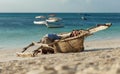 Poor African fisherman repairing his old wooden boat the ocean Royalty Free Stock Photo