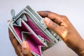 Poor African woman hand open empty purse looking for money having problem bankrupt broke Royalty Free Stock Photo