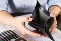 Poor Asian woman hand open empty wallet looking for money having problem bankrupt broke after credit card payday. Insolvency in Royalty Free Stock Photo